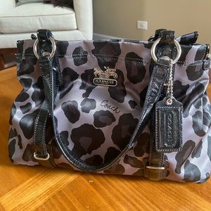 Coach black and gray leopard hand bag